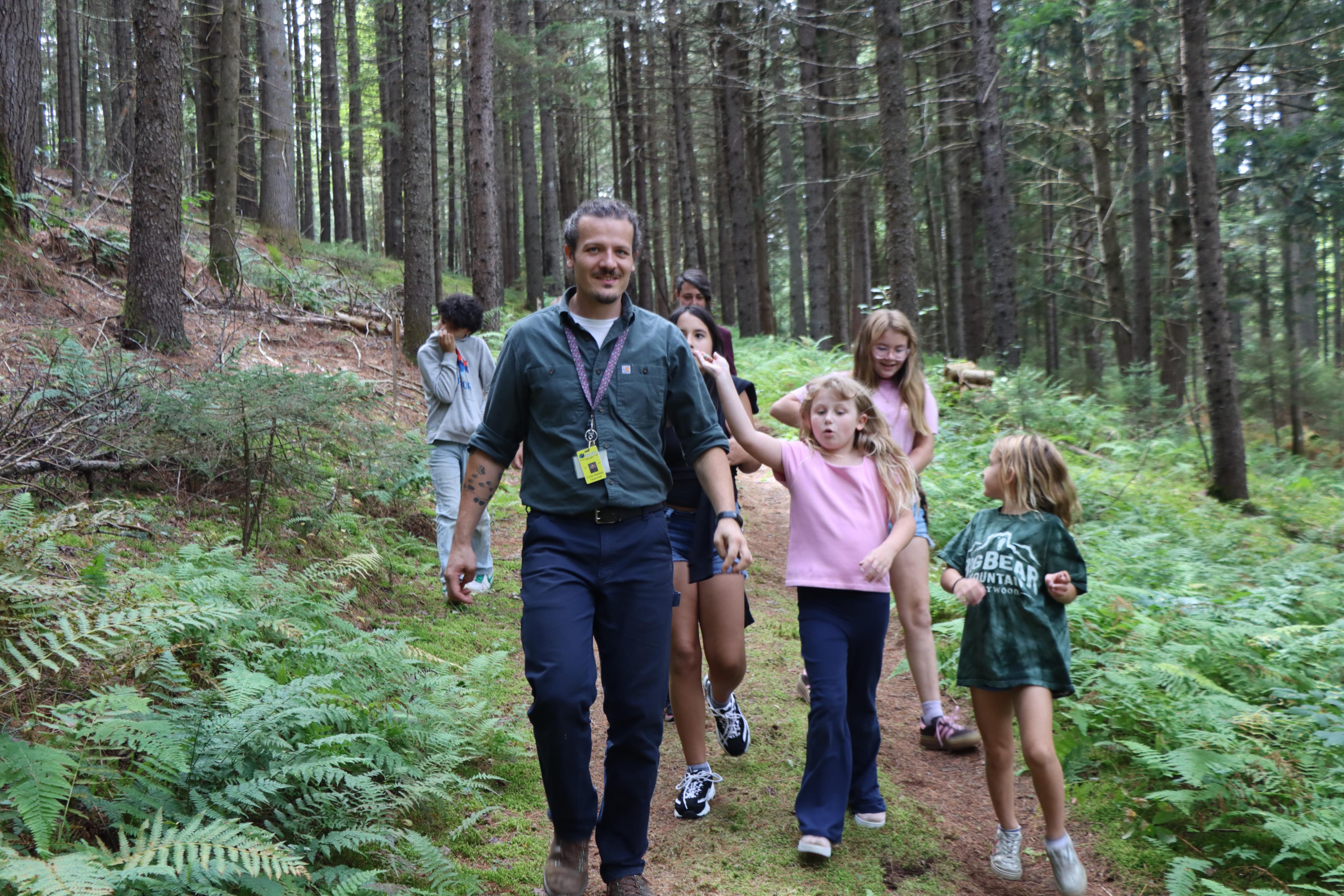 Teache and students hiking the trail