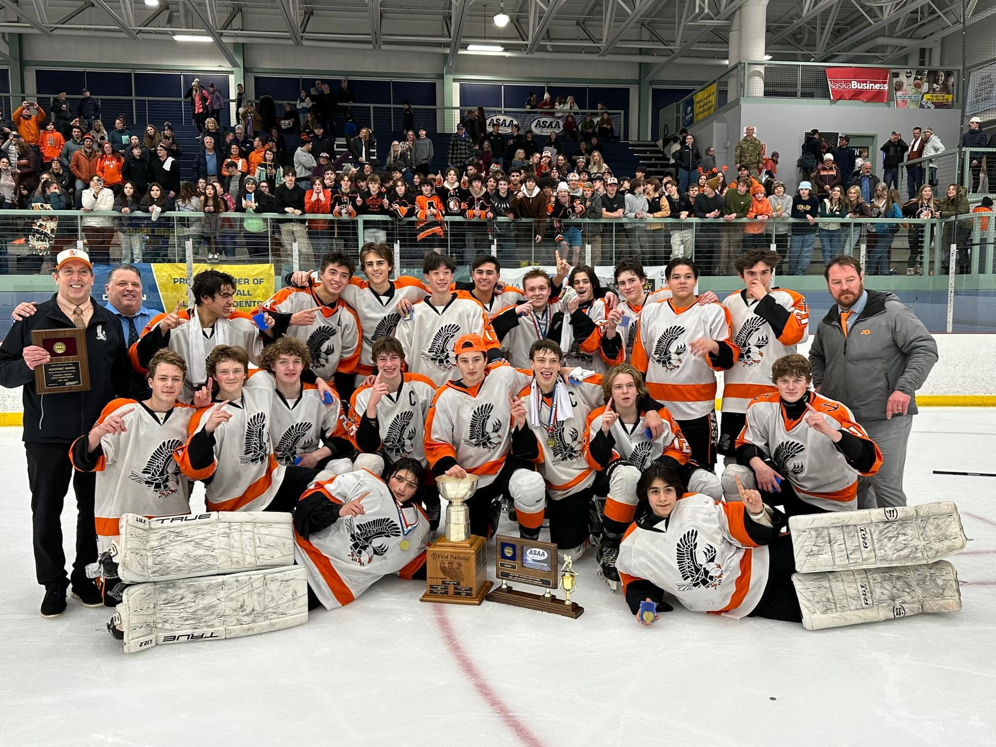 We Won the Hockey Championship! Team holding trophy