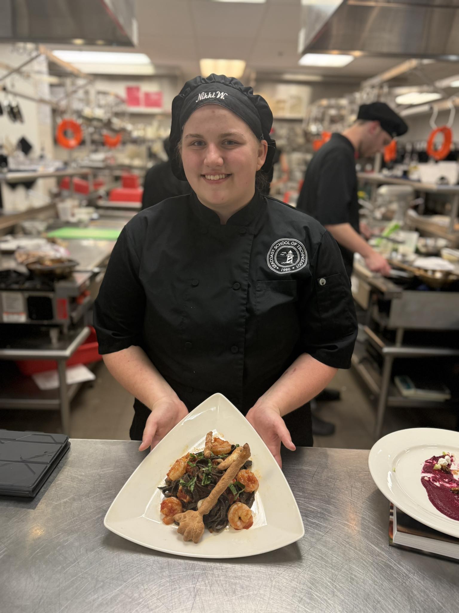 Culinary Arts student showing creation