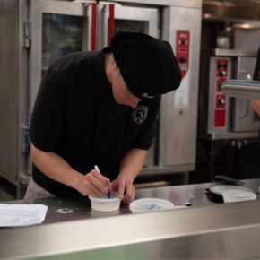 student working in kitchen