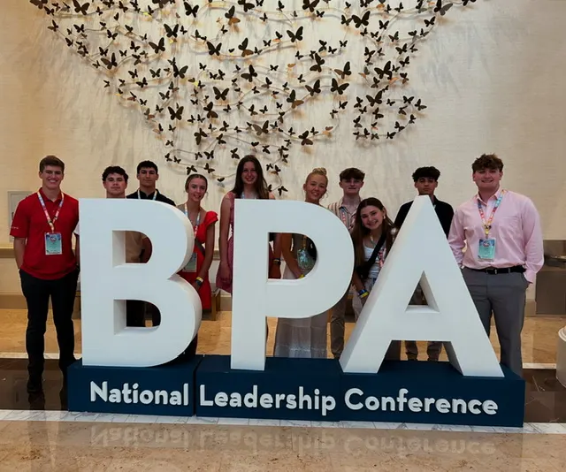 BPA sign with students around it