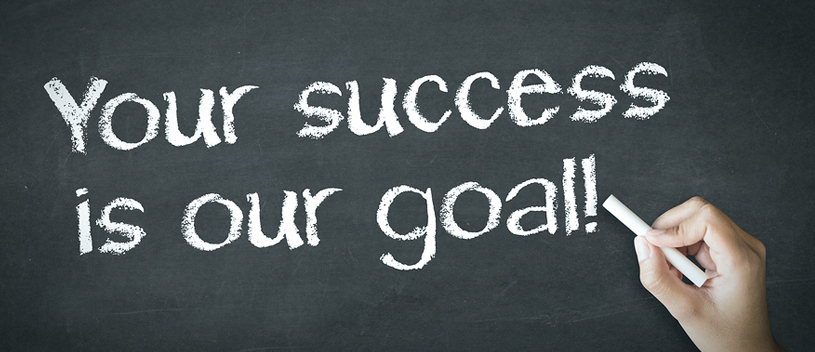 Chalkboard with text stating "Your success is our goal!" - Mission/Vision