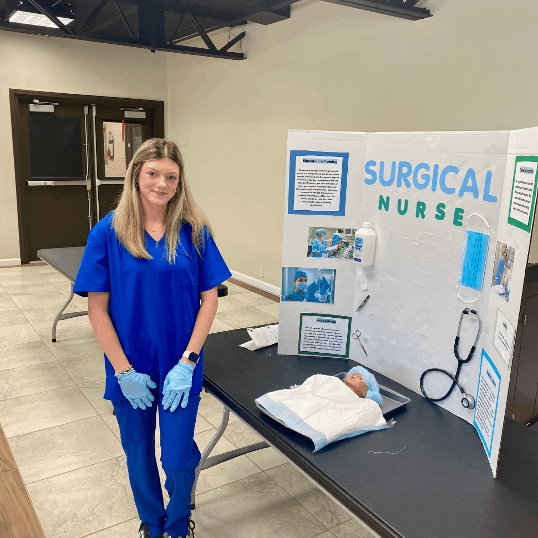 female student standing next to surgical nurse career trifold