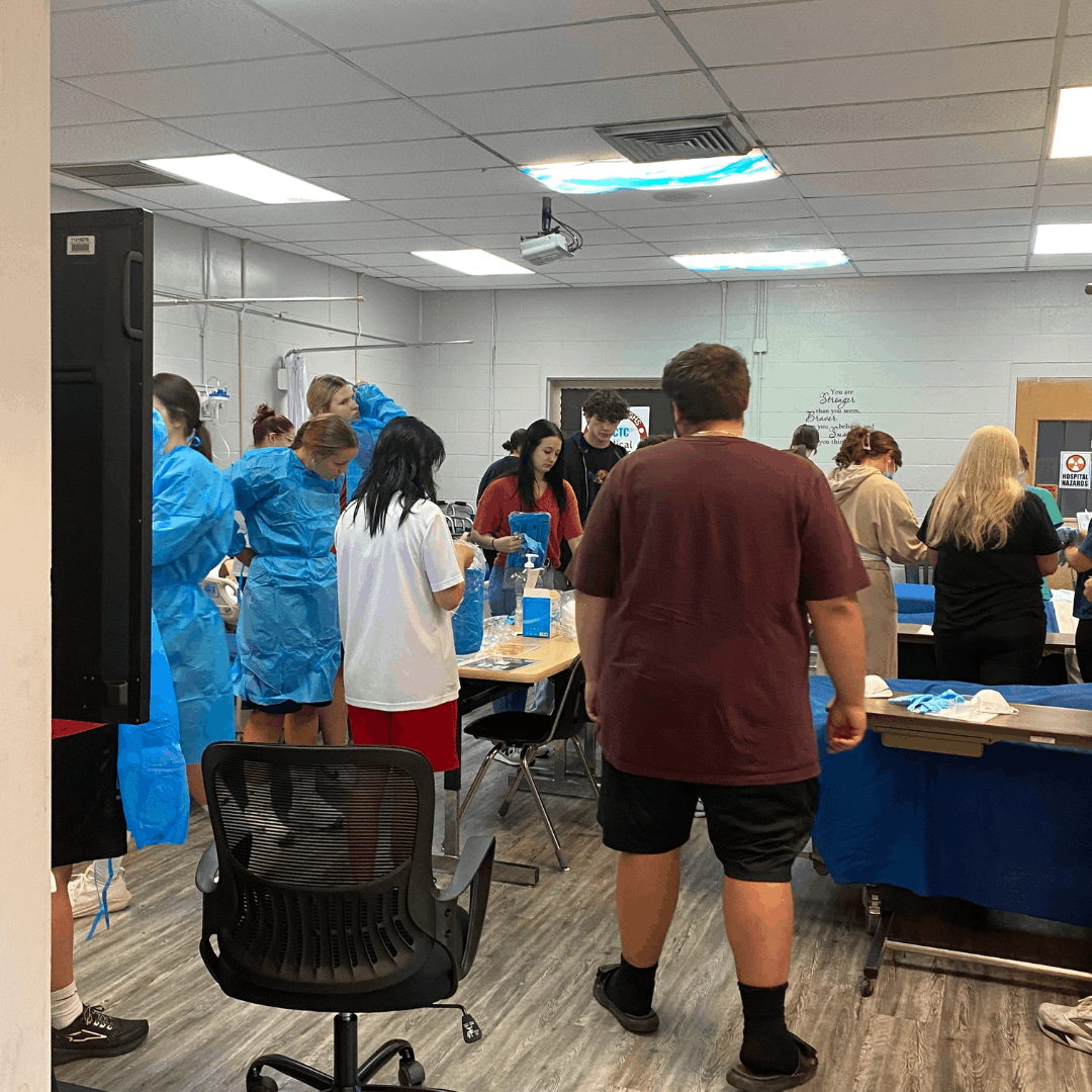 group of students working in the classroom on various projects