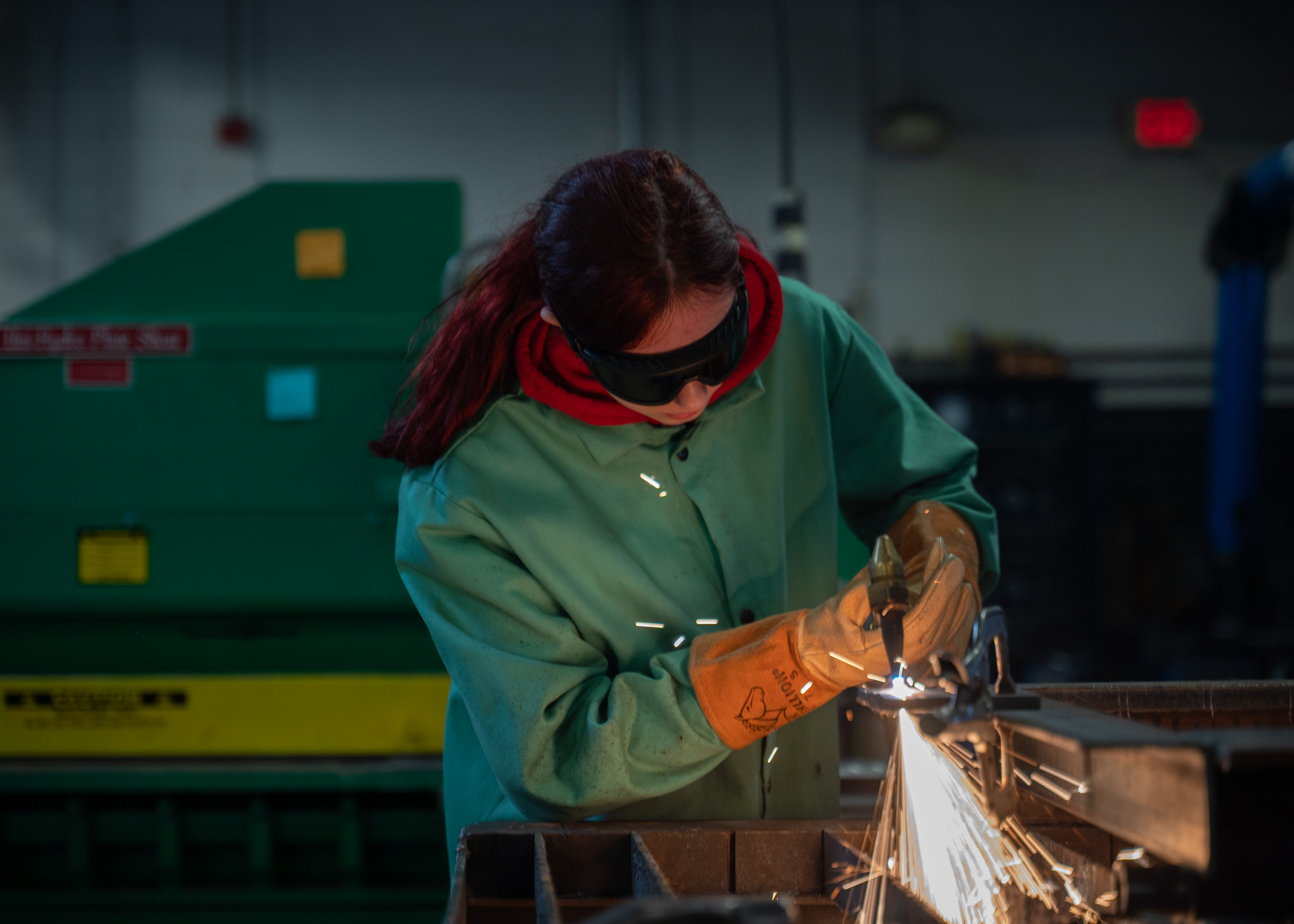 Student welding in the shop