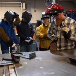 teacher leading demonstration in welding