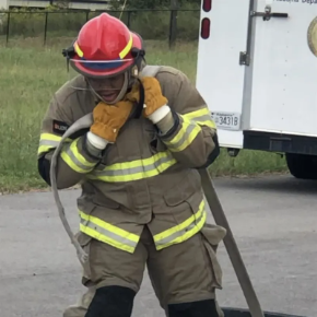 AHS Student working out in fire fighting gear
