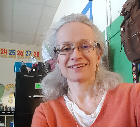 smiling woman in a classroom