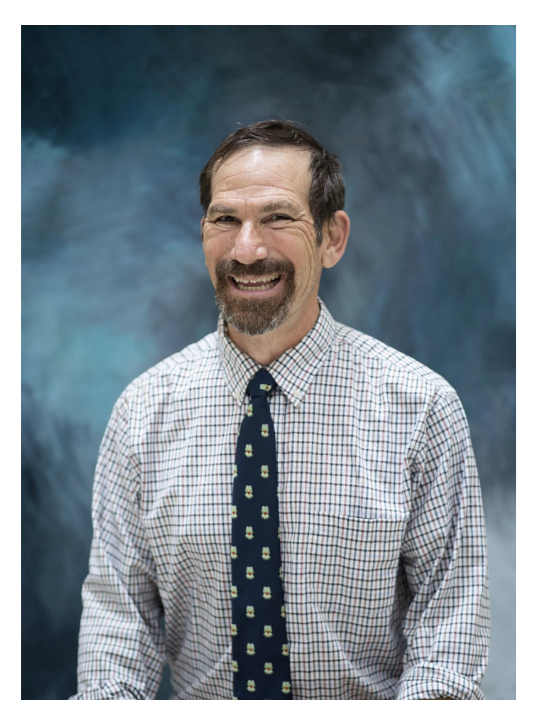Smiling man with blue background
