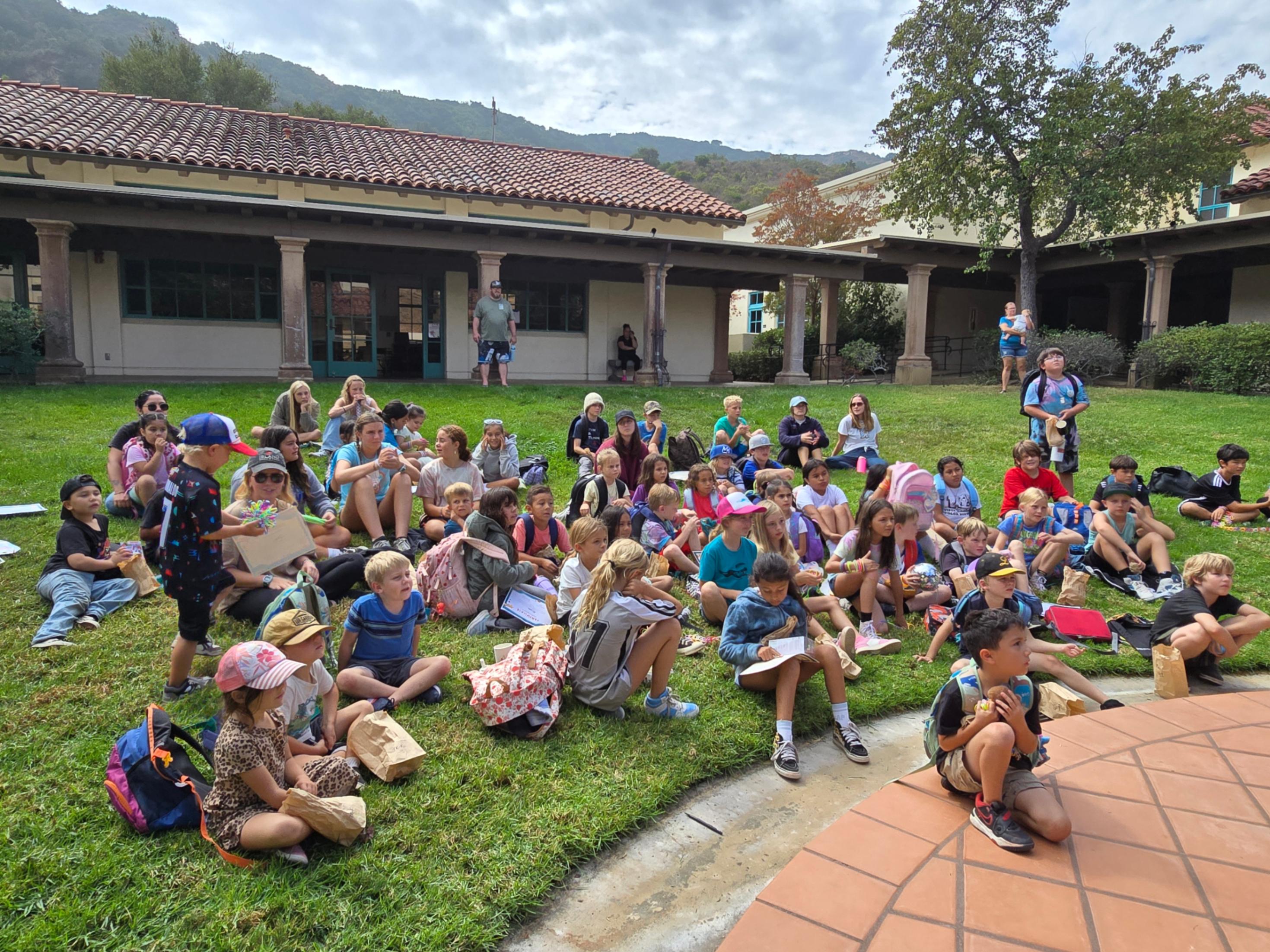 students gathered on the lawn