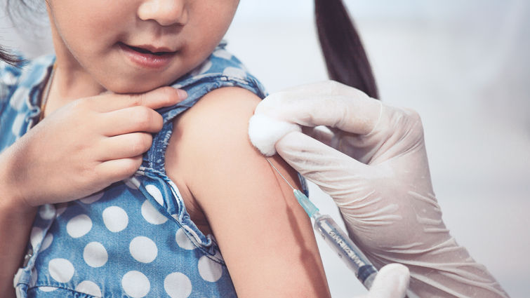 Girl getting vaccine
