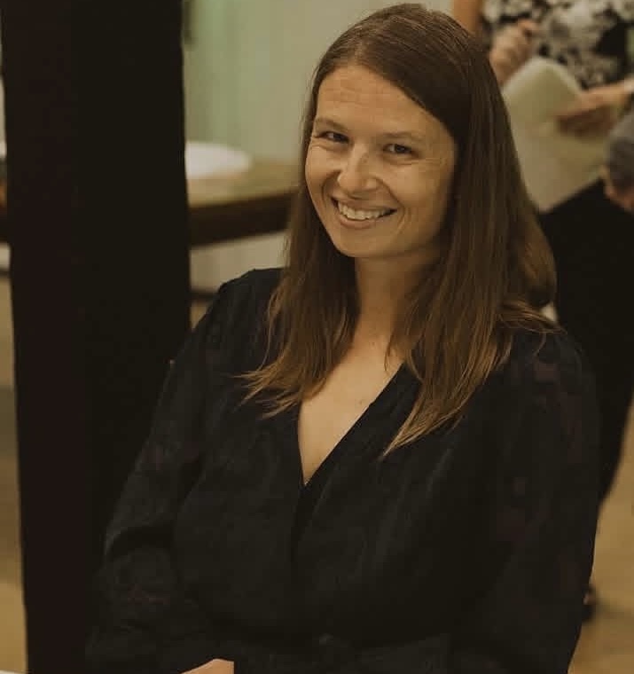 white women sitting and smiling