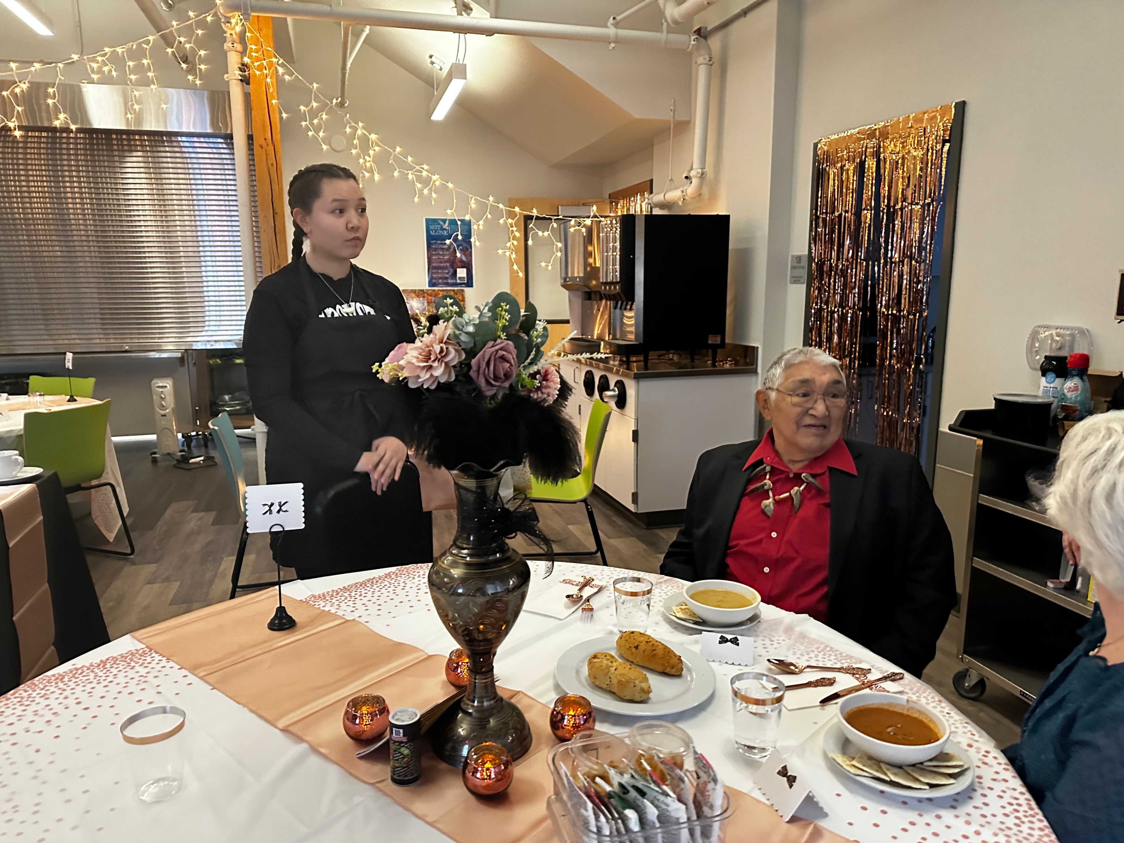 Students serving guests. 