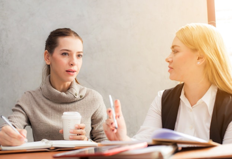 image of two women talking