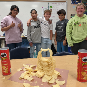 students with a Pringles tower they built