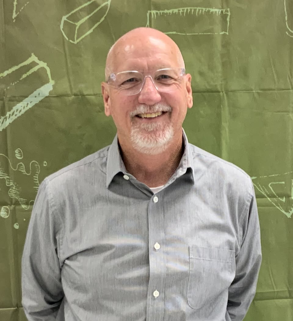 man with hands behind back