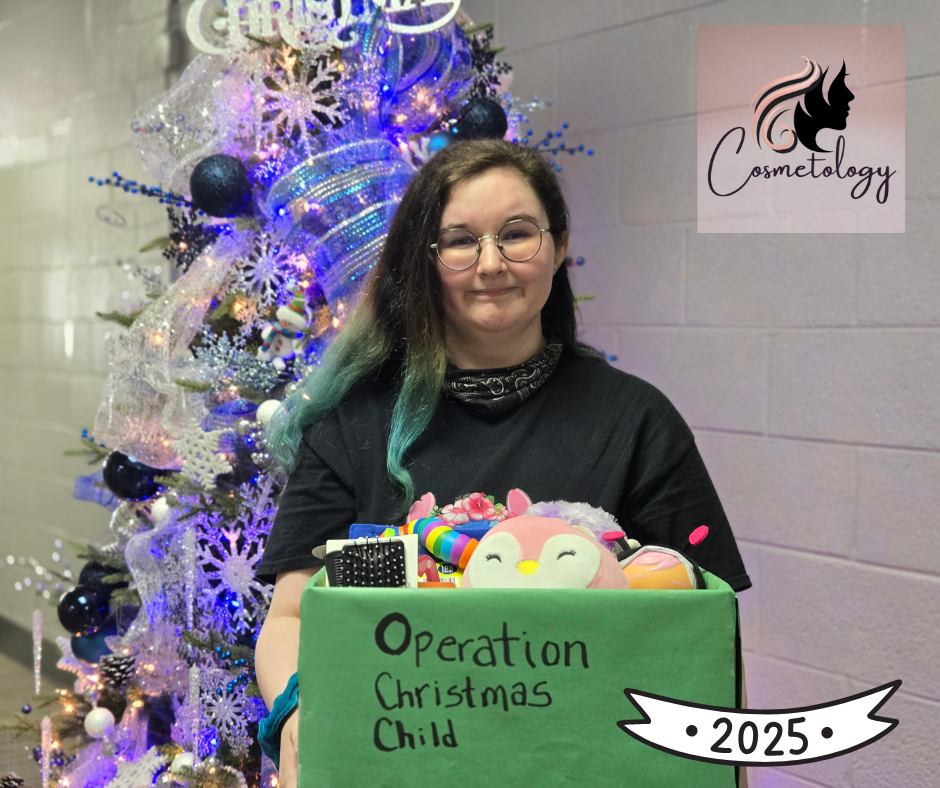 student holding a box full of items for Operation Christmas Child