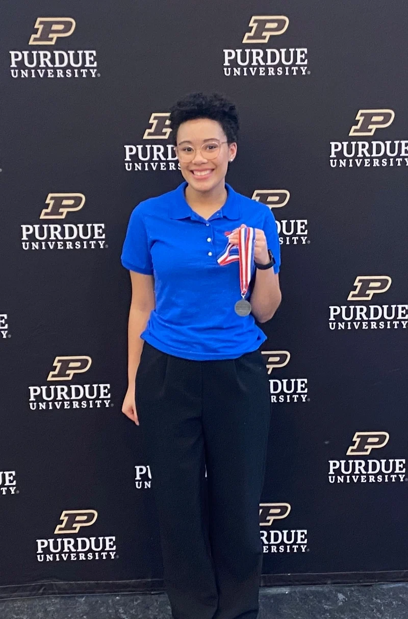 TSA member holding award
