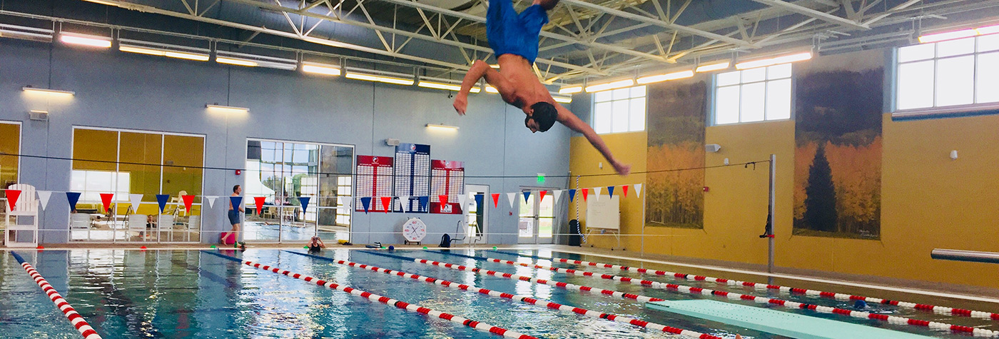 image of man diving into a pool