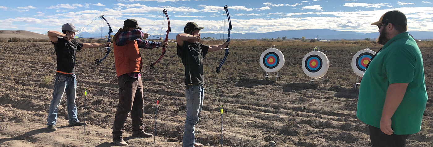 GMCA students practicing bow and arrow