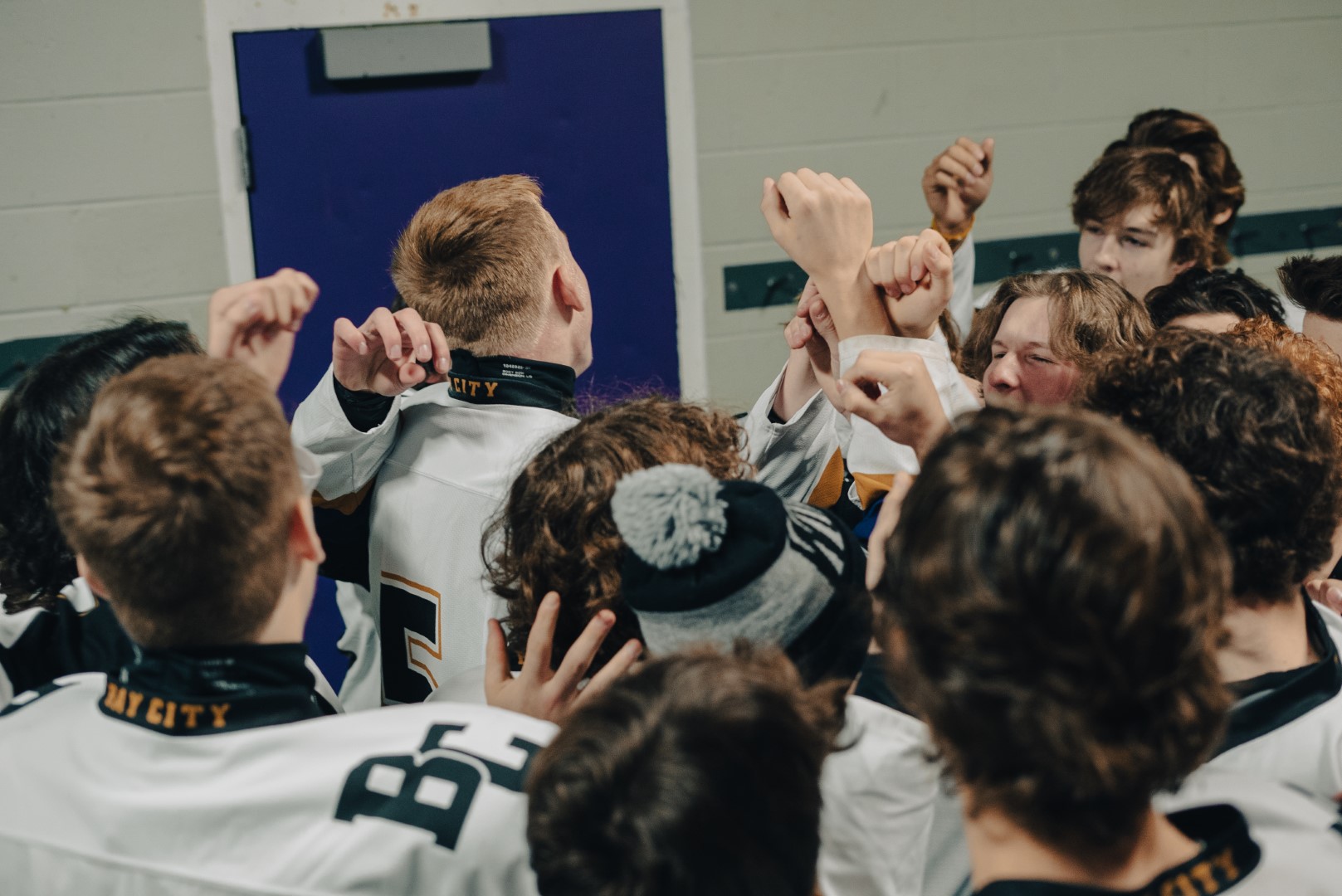 Bay City Wolves hockey team in huddle