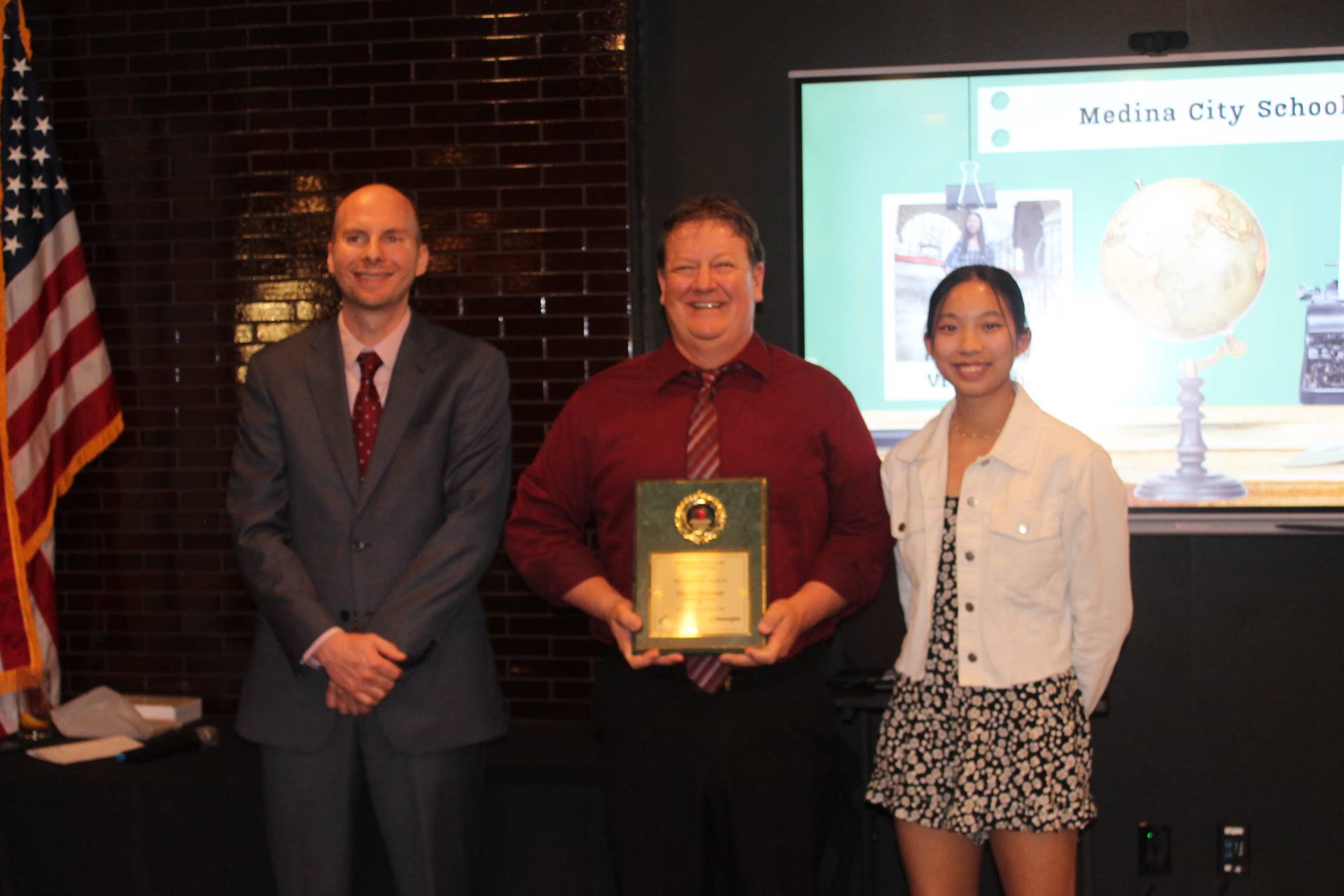 Superintendent Hlasko and Vivian Liu present Mr. Hamman with his Inspiration Teacher award