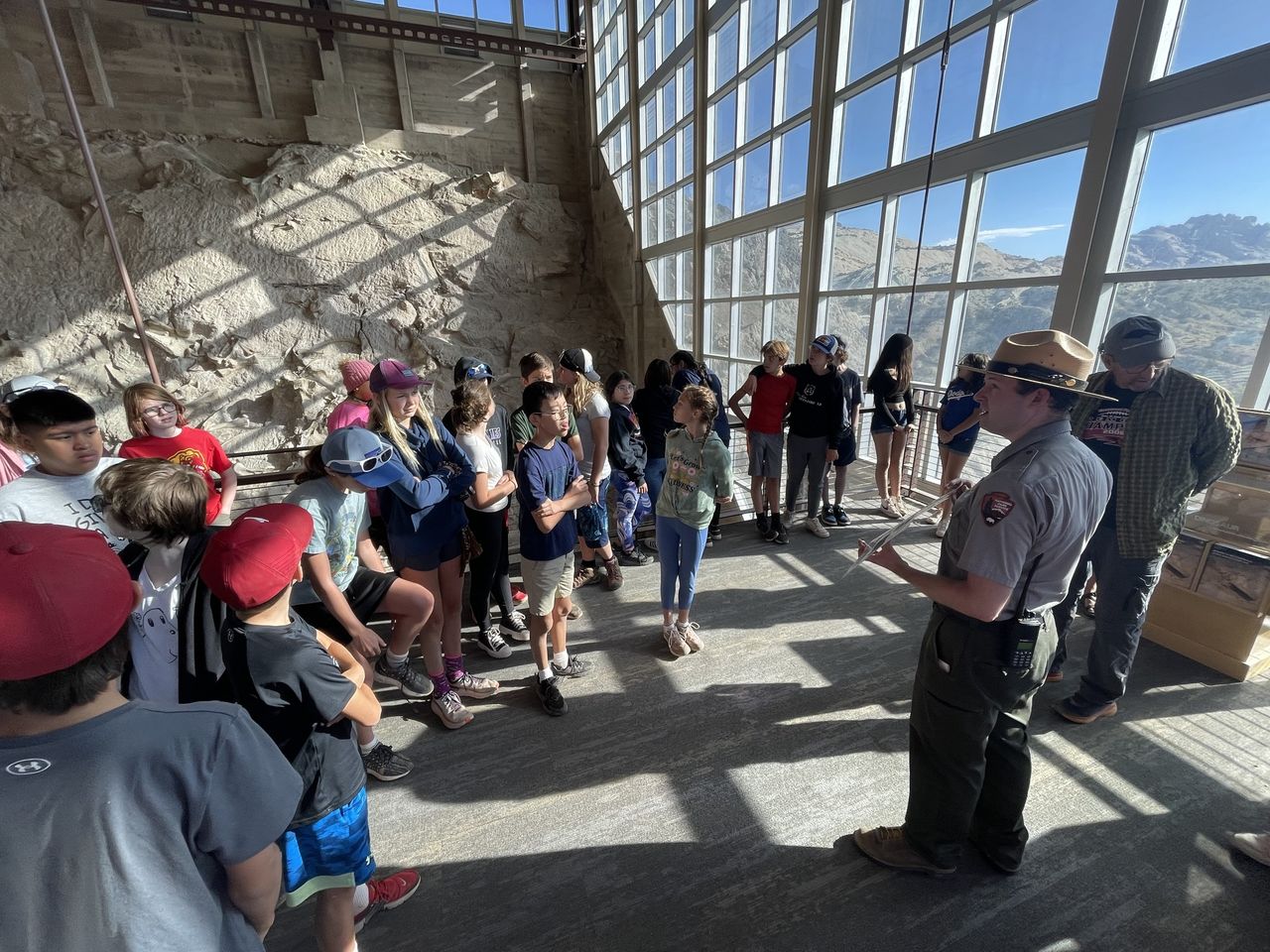 Students being lectured on a field trip by a National Parks ranger