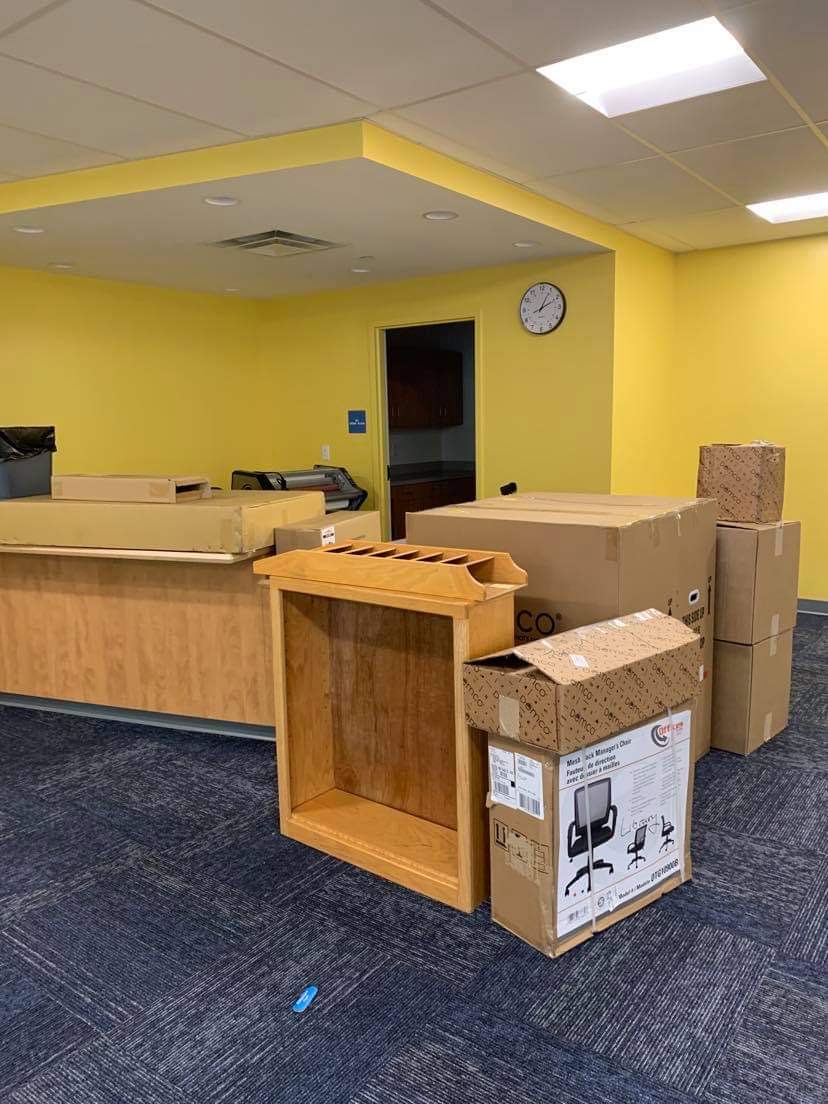 a before picture showing the circulation desk and boxes