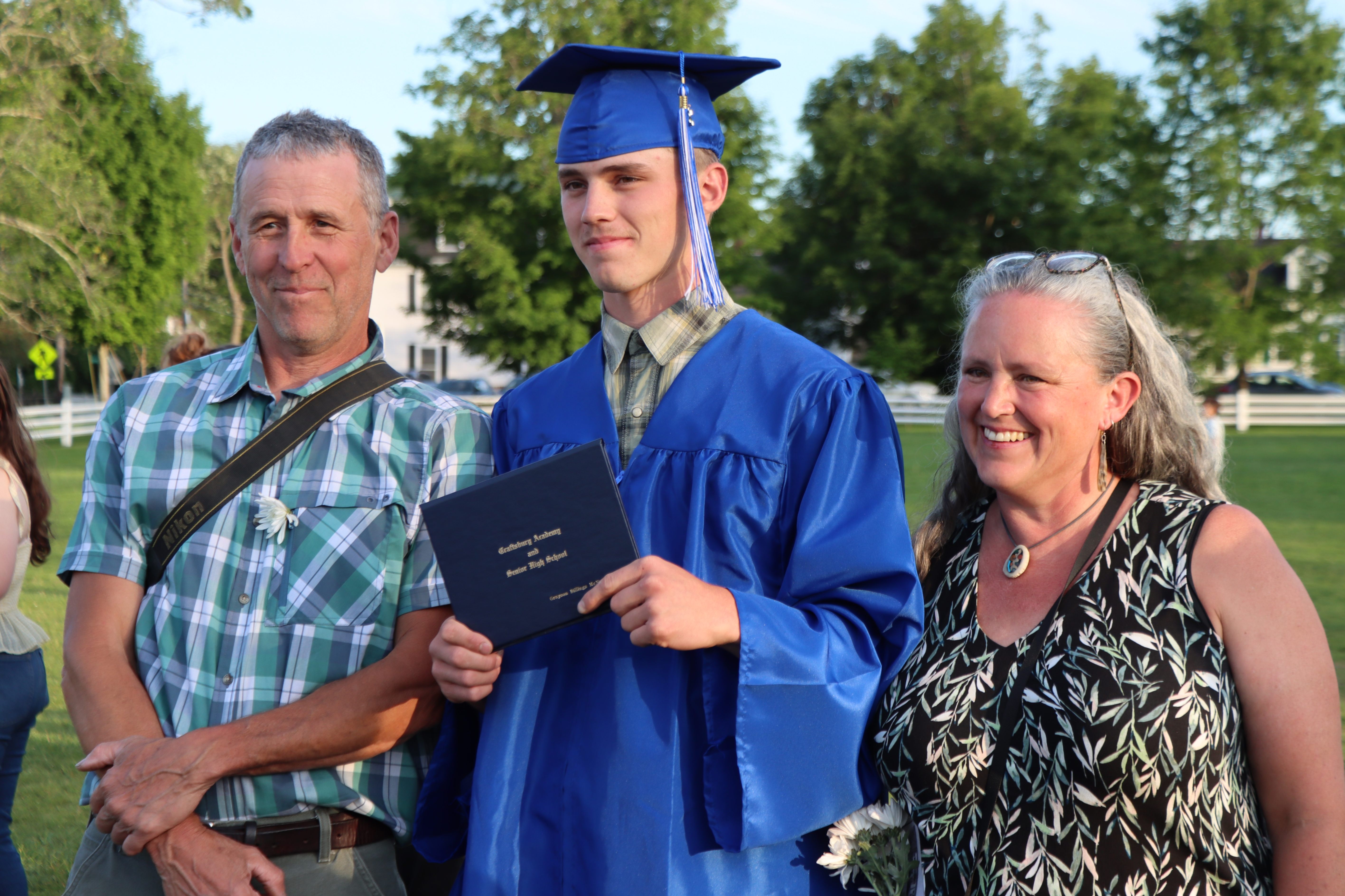 graduate with family