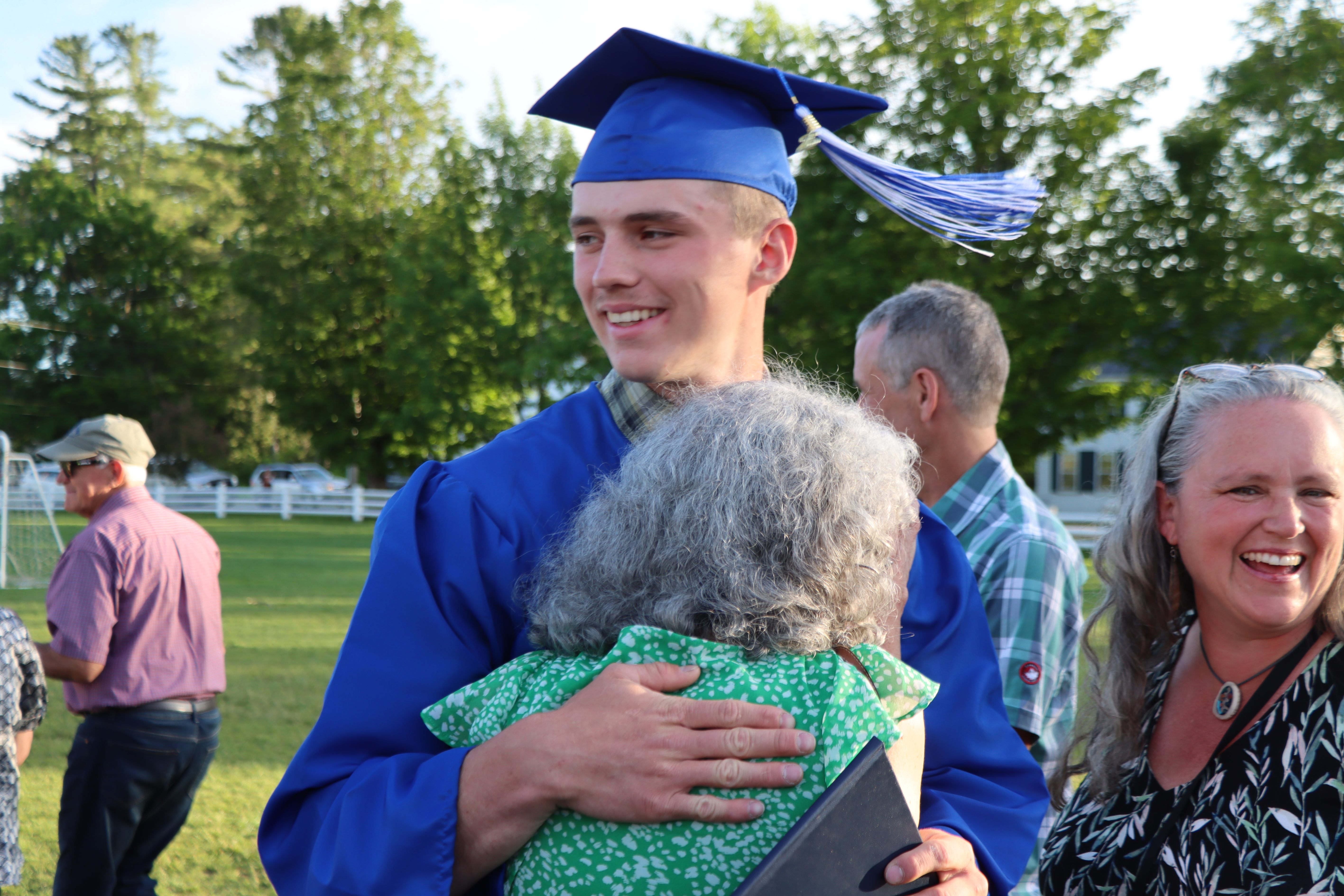graduate with family
