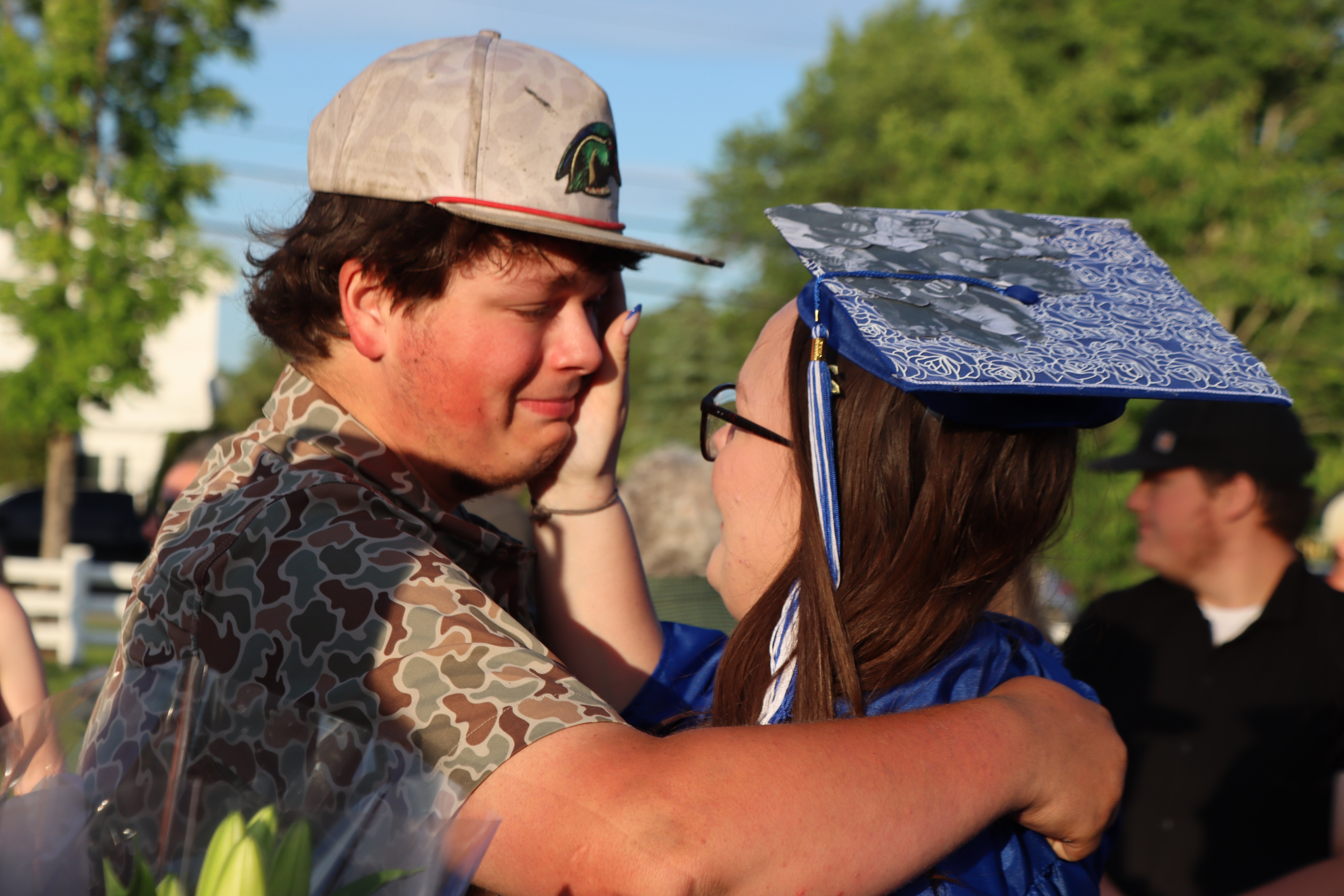 graduate with family
