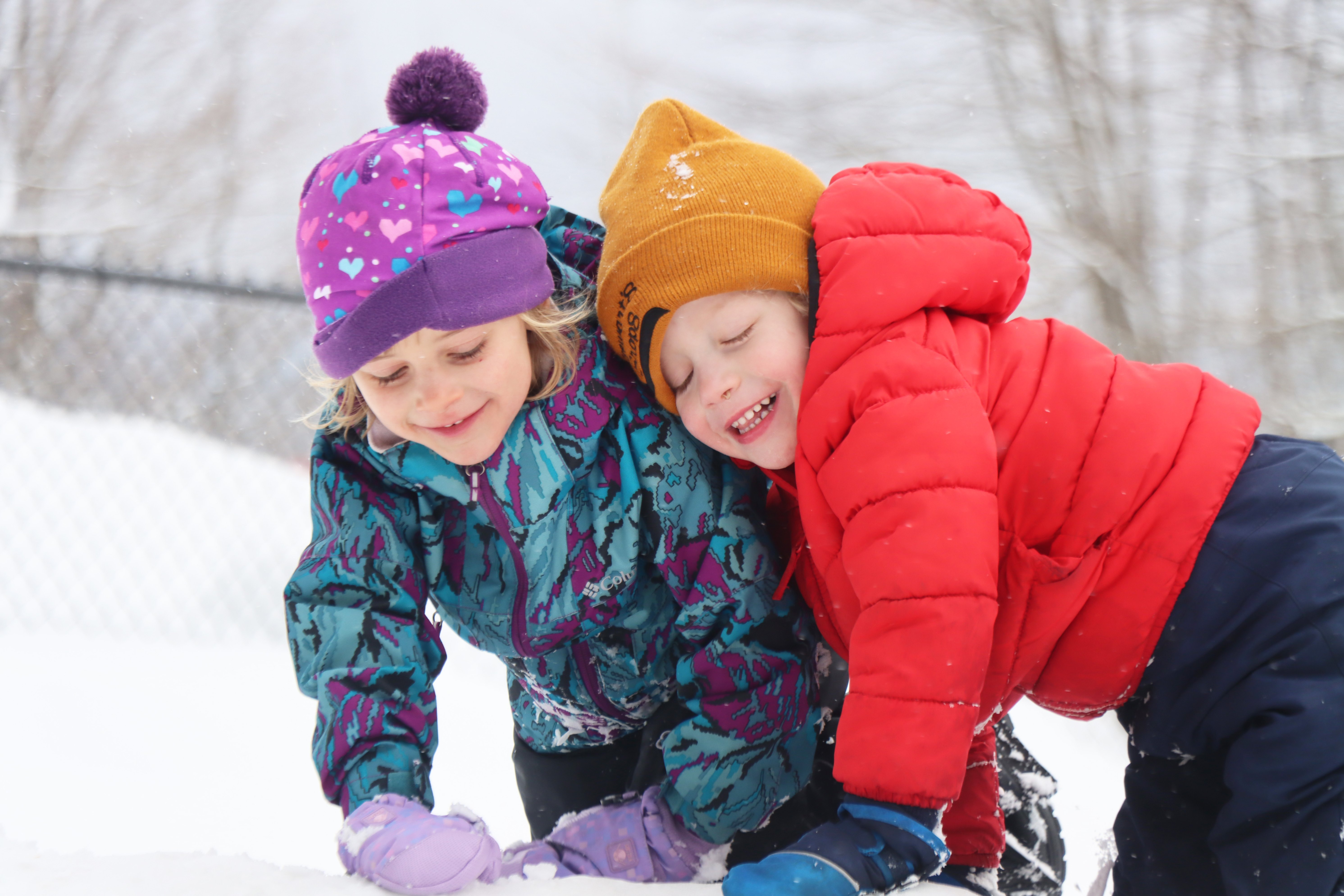 preschool students playing on a snowy day