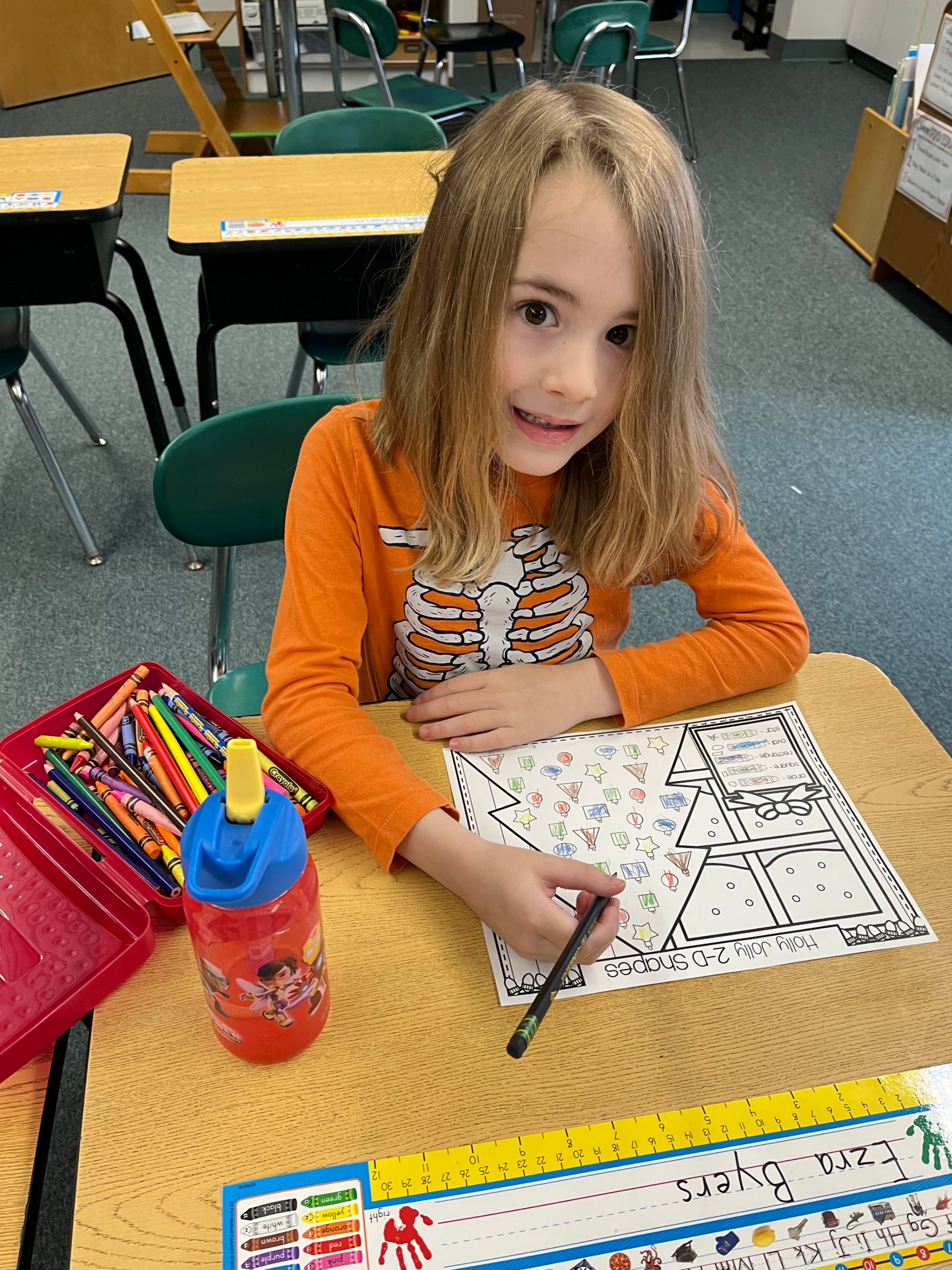 Student coloring 2 D shape