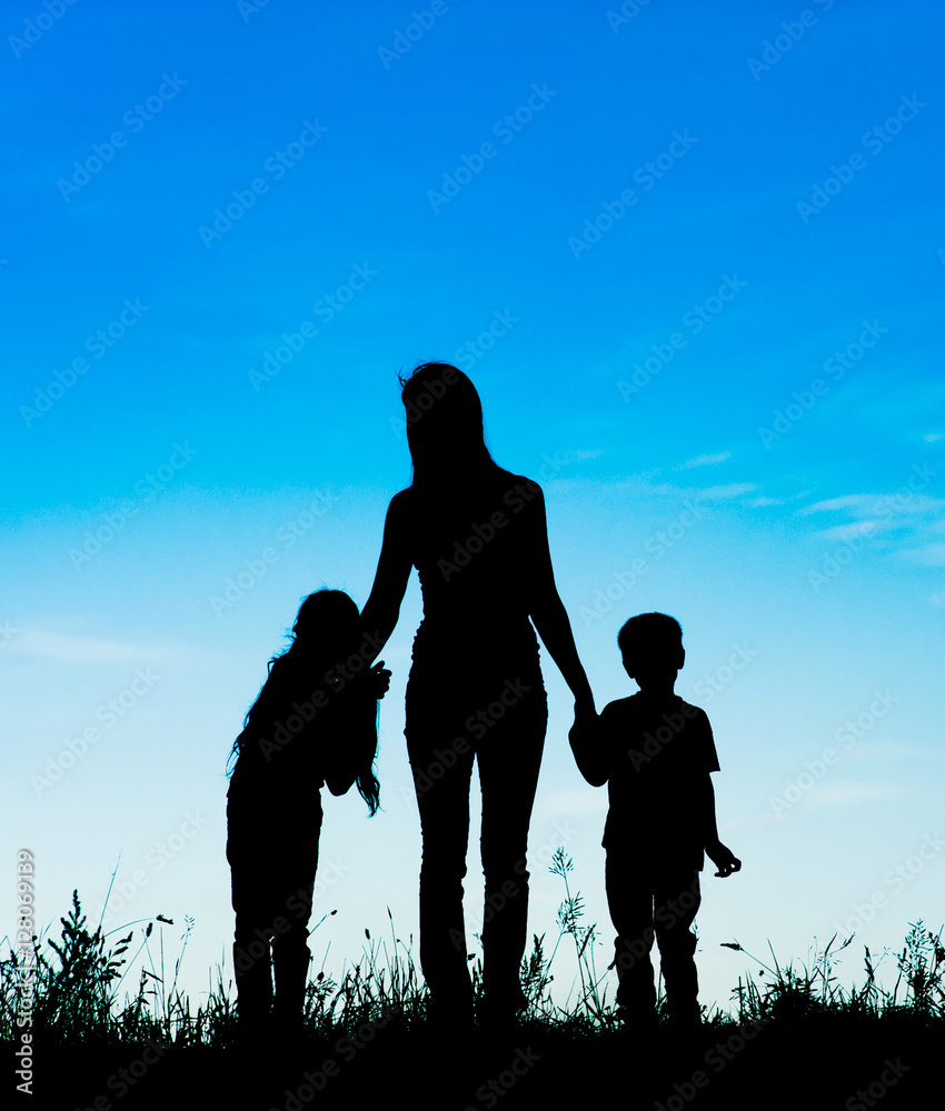 Silhouette of mom and two children 